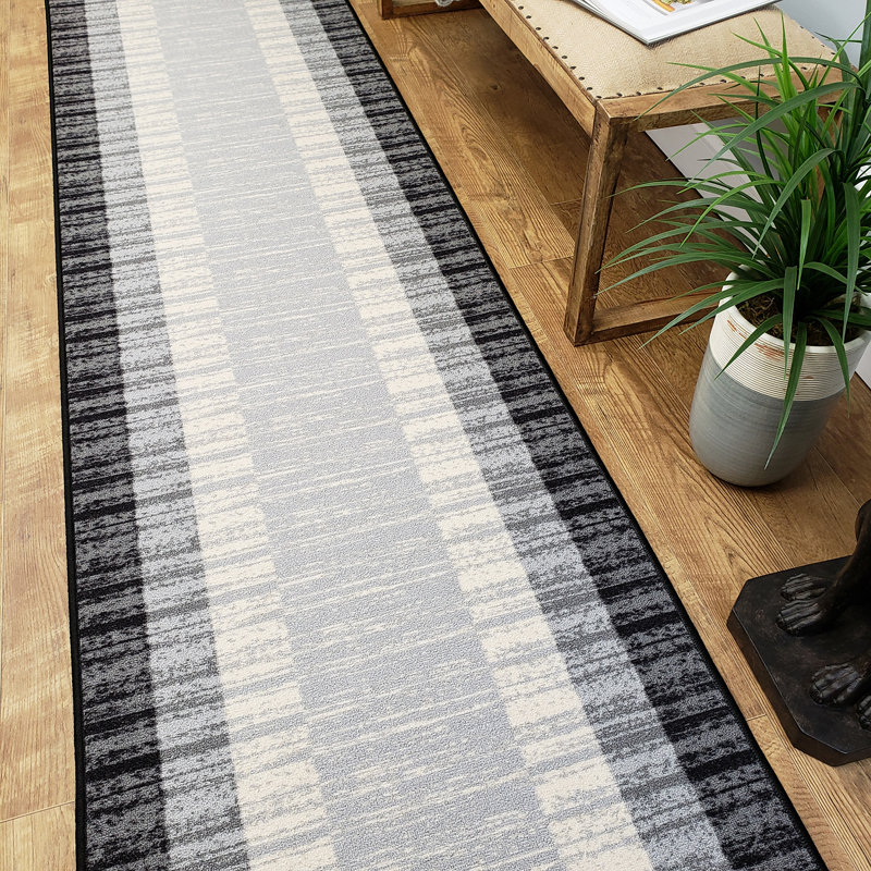 Ebern Designs Zlatkus Striped Rubber Backed Black/Gray Area Rug
